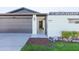 Inviting front entrance with a decorative metal gate and a charming courtyard at 837 E Divot Dr, Tempe, AZ 85283