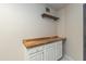 Laundry room showcasing butcher block countertop, white cabinetry, modern design, and plenty of storage at 837 E Divot Dr, Tempe, AZ 85283