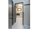 Stylish laundry room featuring patterned tile, a modern washer/dryer set, and ample cabinet space at 837 E Divot Dr, Tempe, AZ 85283