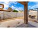 A serene backyard features a covered patio, gravel landscaping, and an outdoor dining area at 8850 W Laurel Ln, Peoria, AZ 85345