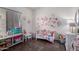 Adorable bedroom with cute floral decorations and pink accents at 8850 W Laurel Ln, Peoria, AZ 85345