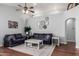 Comfortable living room with vaulted ceilings, a ceiling fan, and a decorative rug at 8850 W Laurel Ln, Peoria, AZ 85345