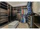 Spacious walk-in closet with custom shelving, drawers, and hanging racks at 891 W Palo Brea Dr, Litchfield Park, AZ 85340