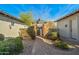 Inviting walkway through stone columns leads to the front door at 891 W Palo Brea Dr, Litchfield Park, AZ 85340