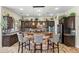 Well-equipped kitchen featuring a stone island, modern appliances, and elegant finishes throughout at 891 W Palo Brea Dr, Litchfield Park, AZ 85340