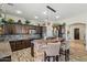 Stylish kitchen with an island, granite countertops, pendant lighting, and a seamless open design at 891 W Palo Brea Dr, Litchfield Park, AZ 85340