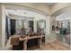 Elegant living room with modern decor, tiled floors, arches, neutral walls and natural lighting at 891 W Palo Brea Dr, Litchfield Park, AZ 85340