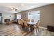 Elegant dining area featuring hardwood floors, a fireplace, and lots of natural light at 932 W Julie Dr, Tempe, AZ 85283