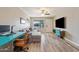 Cozy living room featuring hardwood floors, a sectional sofa, and a bright window at 932 W Julie Dr, Tempe, AZ 85283