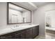 Bathroom vanity featuring double sinks and granite countertop at 9901 N 51St Pl, Paradise Valley, AZ 85253