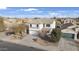 Aerial view of a two-story home with a well-manicured lawn and a driveway at 10146 W Watkins St, Tolleson, AZ 85353