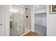 Updated bathroom featuring a glass shower with a chrome frame and a linen closet at 10146 W Watkins St, Tolleson, AZ 85353