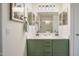 Bathroom with a double sink vanity, white countertop, and a large framed mirror at 10146 W Watkins St, Tolleson, AZ 85353