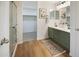 Bathroom with double sink vanity and a glass shower, illuminated by modern vanity lighting at 10146 W Watkins St, Tolleson, AZ 85353