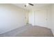 A bedroom featuring neutral carpet and a closet, providing a comfortable and tidy space at 10146 W Watkins St, Tolleson, AZ 85353