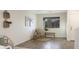 Cozy entryway featuring a wicker chair, a rustic bench, and decorative wall baskets at 10146 W Watkins St, Tolleson, AZ 85353