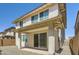 Shot of the backyard with sliding glass doors, patio, and gravel landscaping at 10209 E Ursula Ave, Mesa, AZ 85212