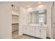 Double sink bathroom with lots of counter space and view of walk in closet at 10209 E Ursula Ave, Mesa, AZ 85212