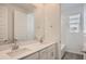 Double sink bathroom with shower in background and large mirror at 10209 E Ursula Ave, Mesa, AZ 85212