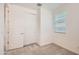 A well-lit bedroom featuring plush carpeting, white walls, a closet with sliding doors and a window at 10209 E Ursula Ave, Mesa, AZ 85212