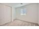 Bedroom with closet space and a bright window, and neutral carpet at 10209 E Ursula Ave, Mesa, AZ 85212