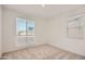 Bright bedroom with plush carpet, white walls, and large windows with blinds at 10209 E Ursula Ave, Mesa, AZ 85212