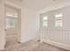 Upstairs hallway with neutral carpet, white walls, and a view to another bedroom at 10209 E Ursula Ave, Mesa, AZ 85212