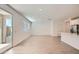 Bright living area featuring an open floor plan, white walls, and neutral tile flooring at 10209 E Ursula Ave, Mesa, AZ 85212