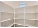 Spacious walk-in pantry with built-in shelving for optimal organization and storage at 10209 E Ursula Ave, Mesa, AZ 85212