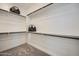 Walk-in closet with multiple rows of shelving and carpeted floor at 10209 E Ursula Ave, Mesa, AZ 85212