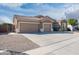 Spacious home featuring an expansive driveway and three-car garage at 10449 E Lomita Ave, Mesa, AZ 85209