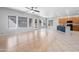 Open-concept living room with wood flooring and ample natural light at 10449 E Lomita Ave, Mesa, AZ 85209