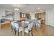 Dining area showcasing open layout with a view to the kitchen and adjacent living spaces at 1052 W Capulin Trl, San Tan Valley, AZ 85140