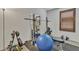 Bright exercise room featuring black rubber flooring and weight lifting equipment at 1052 W Capulin Trl, San Tan Valley, AZ 85140