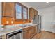 Functional kitchen features stainless steel appliances and ample counter space by the window at 1052 W Capulin Trl, San Tan Valley, AZ 85140