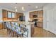 Bright kitchen with stainless steel appliances, granite countertops, and breakfast bar seating at 1052 W Capulin Trl, San Tan Valley, AZ 85140