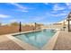 Sparkling pool features a waterfall feature and plenty of space for swimming and relaxing at 1052 W Capulin Trl, San Tan Valley, AZ 85140