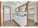 Bathroom with double sinks, modern fixtures and outdoor access at 10540 N 78Th Pl, Scottsdale, AZ 85258