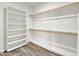 Spacious walk-in closet with shelving and wood hanging rods at 10540 N 78Th Pl, Scottsdale, AZ 85258