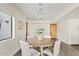 Dining room with a round table and modern light fixture at 10540 N 78Th Pl, Scottsdale, AZ 85258