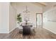 Dining room with modern chandelier and gray upholstered chairs, perfect for elegant meals and entertaining at 10540 N 78Th Pl, Scottsdale, AZ 85258