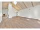 Open living room with skylight and rustic brick fireplace at 10540 N 78Th Pl, Scottsdale, AZ 85258