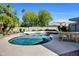 Inviting pool with an umbrella-shaded table and chairs surrounded by lush landscaping at 10540 N 78Th Pl, Scottsdale, AZ 85258