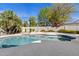 Backyard pool surrounded by a block fence and mature landscaping at 10540 N 78Th Pl, Scottsdale, AZ 85258