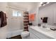 Bathroom with white tile, bathtub, patterned shower curtain, and single sink at 10846 W Crosby Dr, Sun City, AZ 85351