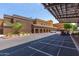 Wide angle exterior view of the Fairway Recreation Center featuring parking spaces, palm trees and desert landscaping at 10846 W Crosby Dr, Sun City, AZ 85351