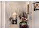 Hallway view into a neutrally decorated living room, featuring a table with flowers and decorative vase at 10846 W Crosby Dr, Sun City, AZ 85351