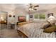 Bedroom features a TV, vanity area, and a large window providing natural light at 10846 W Crosby Dr, Sun City, AZ 85351