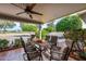 Covered patio featuring ceiling fan, tile flooring, and outdoor furniture at 10846 W Crosby Dr, Sun City, AZ 85351