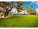 Welcoming entrance to Lakeview Center surrounded by green lawns and mature trees at 10846 W Crosby Dr, Sun City, AZ 85351